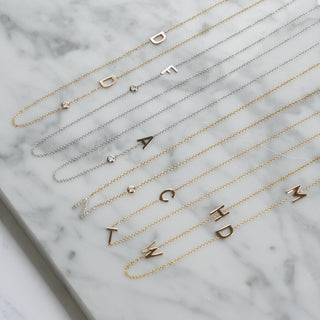 Asymmetrical initial necklaces