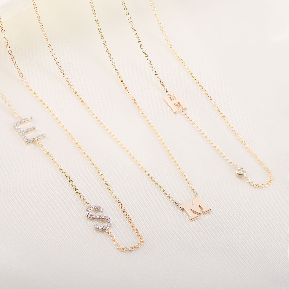 Asymmetrical initial necklaces